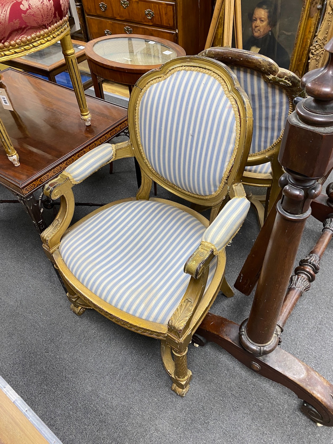 A pair of 19th century French carved giltwood fauteuils, width 63cm, depth 51cm, height 99cm